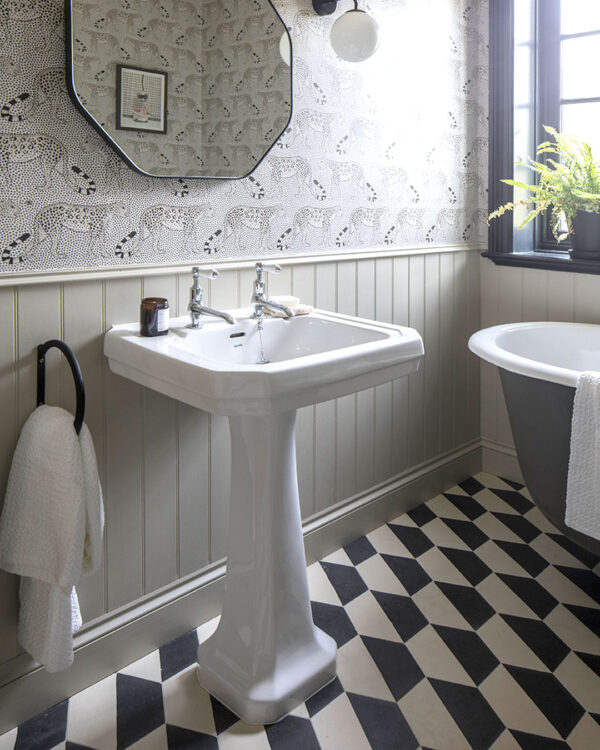 Hex monochrome patterned cement tiles on bathroom floor