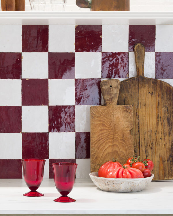 Crimson red and snow white zellige tile checker kitchen splashback